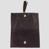 Brown leather clutch bag open flap